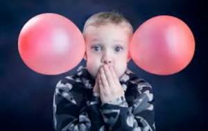 kid with balloons in ears